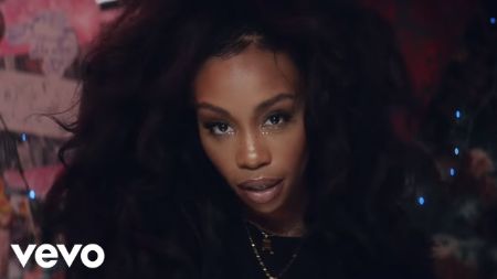 SZA's supermodel music video, in a black outfit 